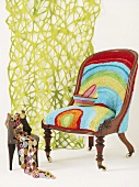 Two chairs in front of green curtain