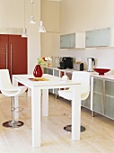 Dining table with two bar stools in kitchen