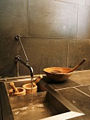 Wooden bowls & two wooden mortar and pestle sets in sink