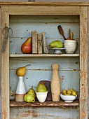 A display of pears in a wooden shelf