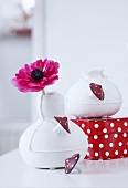 Vases decorated with toadstool buttons