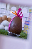 Chocolate Easter egg with gift ribbon