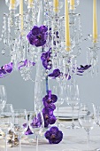 Candelabrum with flowers on table laid for special occasion