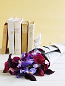 Bunch of irises in front of books