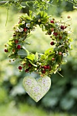 Wreath of wild strawberries with enamel heart