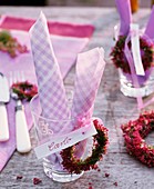 Wreath of bell heather with name card on glass
