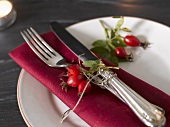 Place-setting with rose hips