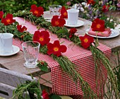 Grass plaits with roses (table decoration)