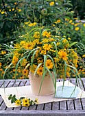 Vase of heliopsis, helenium and grasses