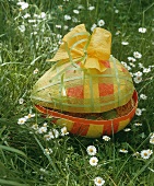 A large Easter egg on a field