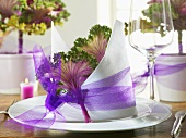 Napkin decoration with tulle ribbon & ornamental cabbage leaf