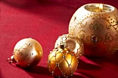 Christmas baubles and a ball shaped candle holder
