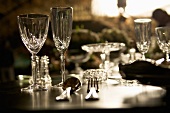 Crystal glasses, crystal bowls and cutlery on a table