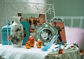 Photographs and souvenirs on side table