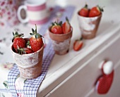 Strawberries in earthenware pots