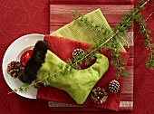 A Christmas stocking with decoration and table linen