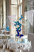 Wedding decoration: a bird cage with butterflies