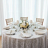 A Formal Table Setting with Three Chairs