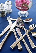 Silverware on a Blue Tablecloth, Flowers, Salt and Pepper