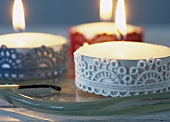 A large tealight decorated with lace