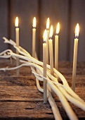 Table decoration with candles and peeled branches