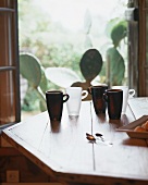 Mugs on a wooden table