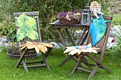 Flower-shaped cuchions on garden chairs