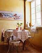 A dining area in front of a window in a country house