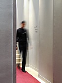 Elegant hotel corridor with blurred person in background