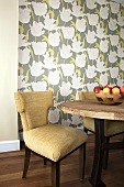 Table and Chair; Bowl of Peaches; Wallpapered Wall