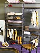 Dressing room with antique chair and open metal shelves