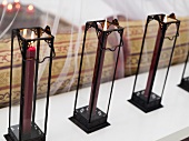 Burning candles in filigree metal stands
