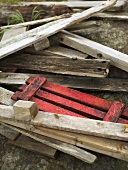 Old wood and a red palette on a stone floor
