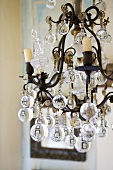 An antique wrought-iron chandelier with glass balls