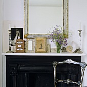 A mantelpiece decorated with picture frames