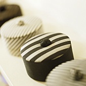 Decorative boxes with black and white striped covers