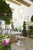 A spacious dining room with a laid table in a Mediterranean country house
