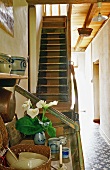 An old flight of wooden stairs in the hallway of a farm house