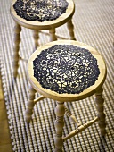 Wooden stool with black painted decoration