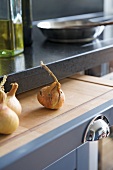 Onions on chopping board