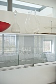 Glassware in wall mounted cabinet