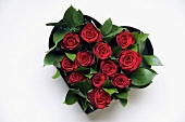 Red roses in a heart-shaped bowl