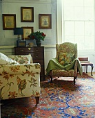 Various upholstered armchairs on an oriental rug in a traditional living room