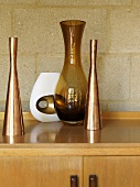 Various vases and an aroma oil lamp on a table