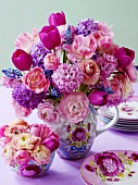 A bunch of flowers in various shades of pink