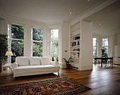 An open-plan minimalistic living room in a villa