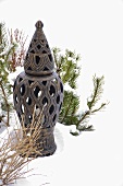 An oriental garden lantern in the snow