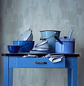 Blue kitchen table with enamelled pans