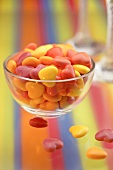 Coloured hearts in a glass bowl