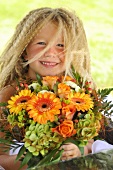 Blond girl with bouquet of flowers